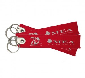 China hot sale 70year mea logo embroidery/woven keychain